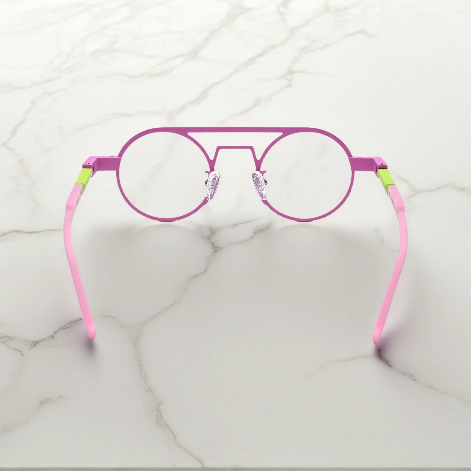 Rear angle displaying the ergonomic nose pads and lightweight design in Candy Lime color-block titanium frame with pink-green tones, part of the NeoPilot series
